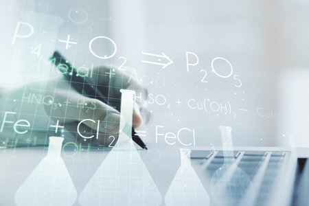 Creative chemistry illustration with hand writing in diary on background with laptop, science and research concept. Multiexposureの写真素材