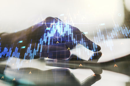 Multi exposure of abstract creative financial chart with world map and with finger presses on a digital tablet on background, research and analytics conceptの写真素材