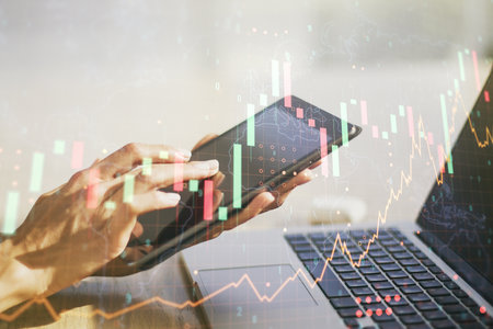 Multi exposure of abstract creative financial graph with world map and finger presses on a digital tablet on background, forex and investment conceptの写真素材