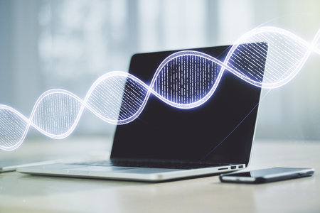 Double exposure of creative DNA hologram on laptop background. Bio Engineering and DNA Research conceptの写真素材