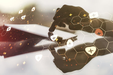 Creative concept of abstract medical illustration and finger clicks on a digital tablet on background. Medicine and healthcare concept. Multiexposureの写真素材