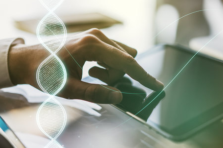 Creative light DNA illustration and finger presses on a digital tablet on background, science and biology concept. Multiexposureの写真素材