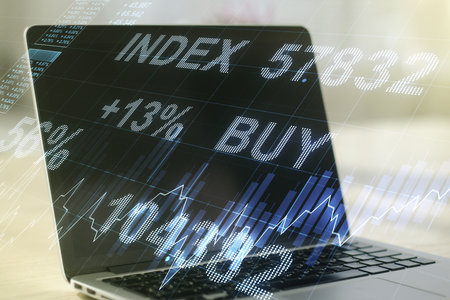 Abstract creative financial graph on modern laptop background, financial and trading concept. Multiexposureの写真素材