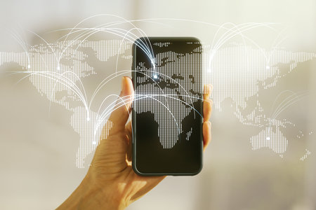 Double exposure of abstract digital world map with connections and hand with cell phone on background, research and strategy conceptの写真素材