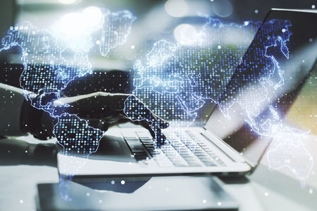 Multi exposure of abstract graphic world map and hands typing on computer keyboard on background, big data and networking conceptの写真素材
