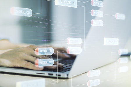 Double exposure of abstract creative programming illustration and hands typing on laptop on background, big data and blockchain conceptの写真素材
