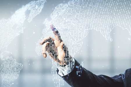Multi exposure of man hand working with abstract graphic world map on blurred office background, connection and communication conceptの写真素材