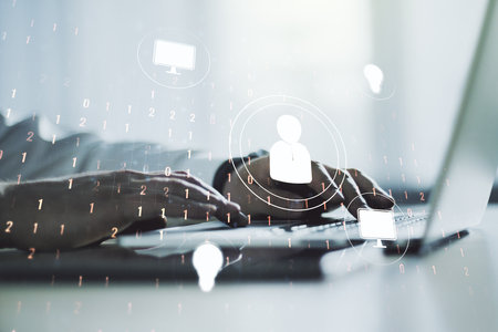 Double exposure of social network icons concept with hands typing on laptop on background. Marketing and promotion conceptの写真素材