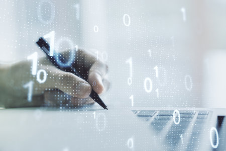 Creative abstract binary code sketch and hand writing in notepad on background with laptop, hacking and matrix concept. Multiexposureの写真素材