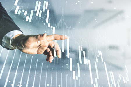 Multi exposure of analyst hand with pen working with virtual abstract financial diagram on blurred office background, banking and accounting conceptの写真素材