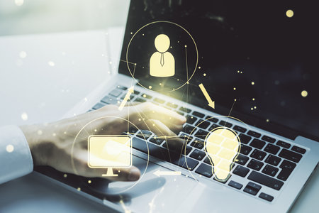 Double exposure of social network icons concept with hand typing on computer keyboard on background. Networking conceptの写真素材