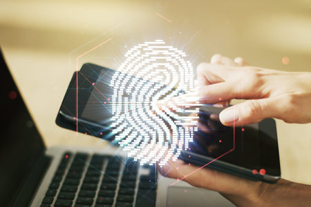 Double exposure of abstract creative fingerprint hologram with finger clicks on a digital tablet on...