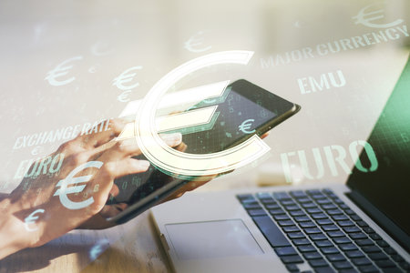 Creative EURO symbols illustration and finger presses on a digital tablet on background, forex and currency concept. Multiexposureの写真素材
