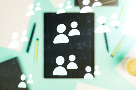 Social network media concept and modern digital tablet on desktop on background, top view. Double exposureの写真素材