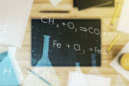 Creative chemistry illustration and modern digital tablet on desktop on background, top view,...