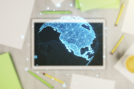 Digital America map and modern digital tablet on background, top view, international trading concept. Multiexposureの写真素材