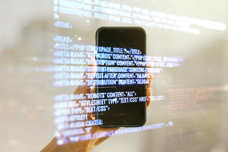 Multi exposure of abstract software development hologram and hand with cell phone on background,...