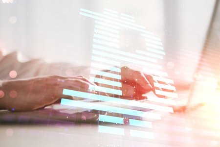 Double exposure of creative Bitcoin symbol with hands typing on laptop on background. Cryptocurrency...