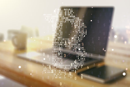 Double exposure of creative Bitcoin symbol and modern desktop with laptop on background. Cryptocurrency conceptの写真素材