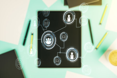 Double exposure of social network icons concept and modern digital tablet on background. Networking conceptの写真素材