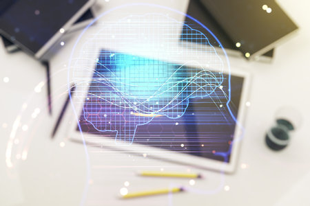 Double exposure of creative human head microcircuit and modern digital tablet on background. Future technology and AI conceptの写真素材