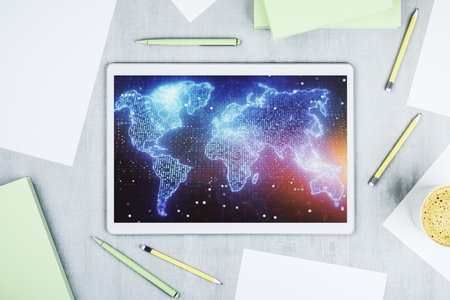 Top view of modern digital tablet display with abstract graphic world map, big data and networking concept. 3D Renderingの写真素材