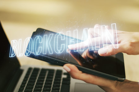Creative concept of blockchain technology and finger clicks on a digital tablet on background....