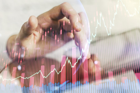 Abstract creative financial graph with world map and finger clicks on a digital tablet on background, financial and trading concept. Multiexposureの写真素材
