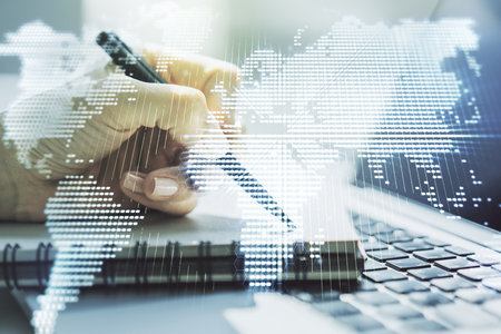 Multi exposure of abstract graphic world map and hand writing in diary on background with laptop, big data and networking conceptの写真素材