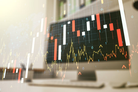 Abstract creative financial graph with world map and modern desktop with computer on background, forex and investment concept. Multiexposureの写真素材