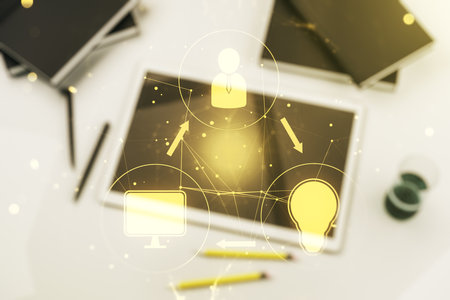 Double exposure of social network icons concept and digital tablet on background, top view. Marketing and promotion conceptの写真素材