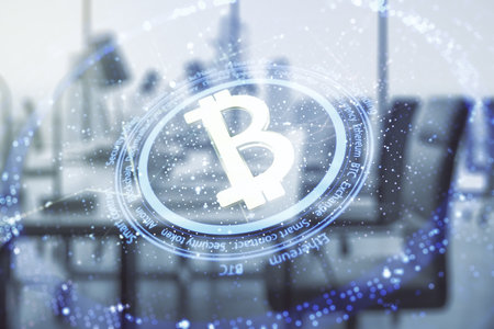 Virtual Bitcoin hologram on a modern furnished office background. Multiexposureの写真素材