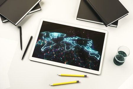 Abstract creative world map on modern digital tablet monitor, tourism and traveling concept. Top view. 3D Renderingの写真素材
