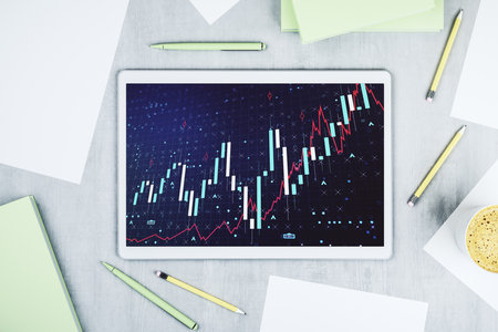 Modern digital tablet monitor with abstract creative financial chart, research and analytics concept. Top view. 3D Renderingの写真素材