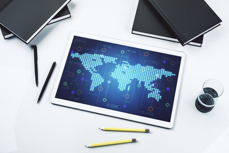 Abstract creative world map on modern digital tablet monitor, tourism and traveling concept. Top view. 3D Renderingの写真素材