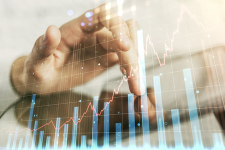 Abstract creative financial graph with finger clicks on a digital tablet on background, forex and investment concept. Multiexposureの写真素材