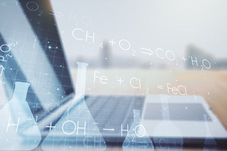 Creative chemistry concept on modern laptop background. Multiexposureの写真素材