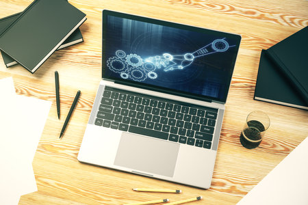 Creative concept of robotics technology on modern laptop screen. Robot development and automation concept. 3D Renderingの写真素材