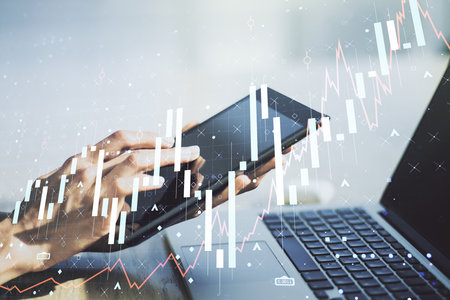Multi exposure of abstract creative financial graph with finger presses on a digital tablet on background, forex and investment conceptの写真素材