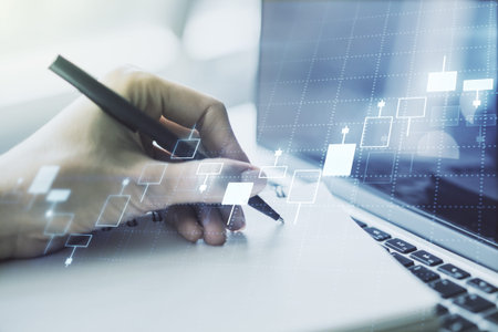 Multi exposure of abstract creative financial graph with hand writing in notepad on background, forex and investment conceptの写真素材