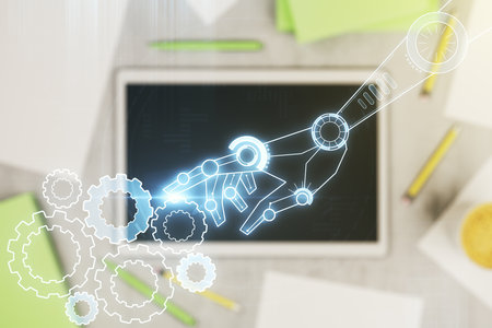Creative concept of robotics technology and modern digital tablet on background, top view. Robot development and automation concept. Multiexposureの写真素材