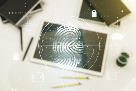 Double exposure of abstract creative fingerprint hologram and modern digital tablet on background, protection of personal information conceptの写真素材