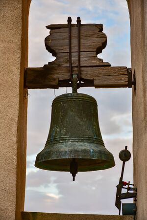 Old bell in a bell towerの写真素材