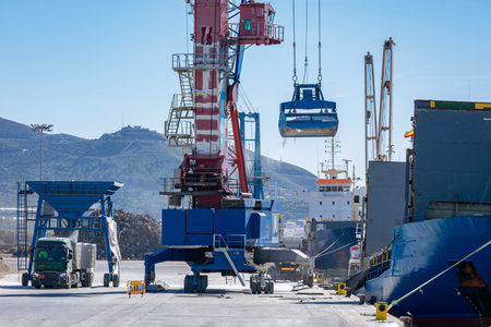 Crane in the port unloading a ship carrying fertilizer
