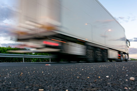 Moving truck driving on the highway at high speed