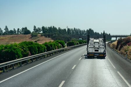 Empty car carrier truck driving on the highwayの写真素材