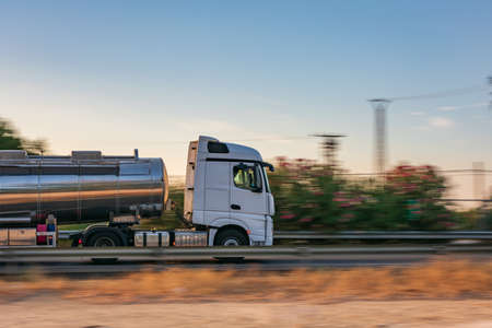 Tank truck driving fast on the highwayの写真素材