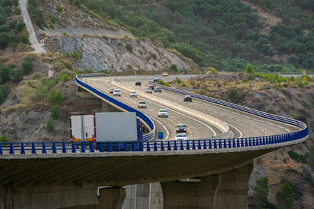 Truck with refrigerated semi-trailer driving on a viaduct.の写真素材