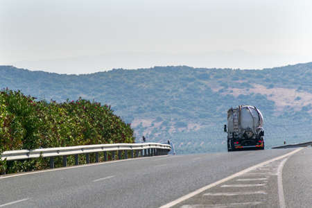 Steel tank truck driving on the highway, rear view.の写真素材