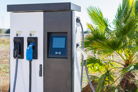 Vending device with different types of connectors for electric vehicle charging.
